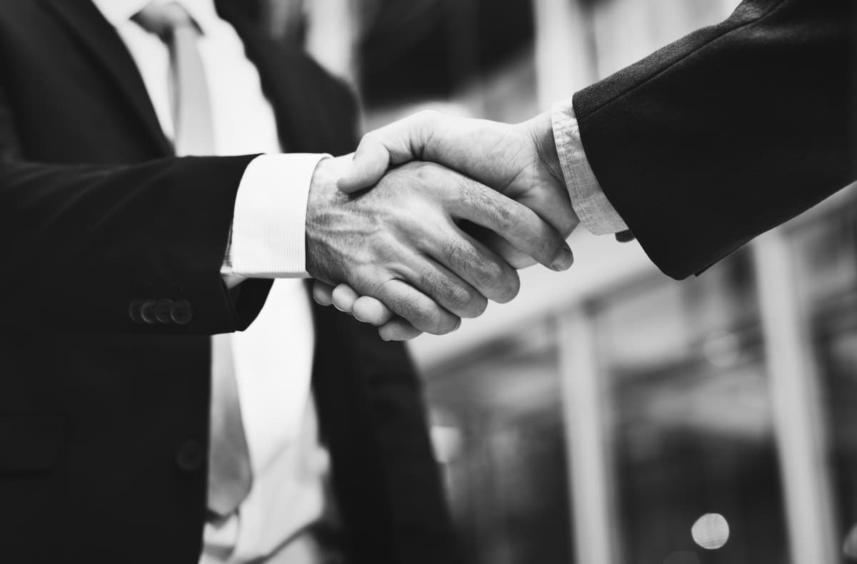 Professional handshake representing trust and partnership in construction